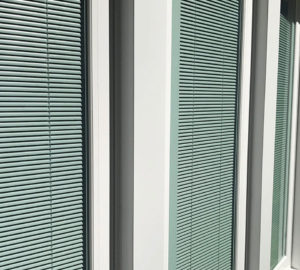 A close up of the window blinds on a building