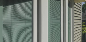 A close up of the window blinds on a building