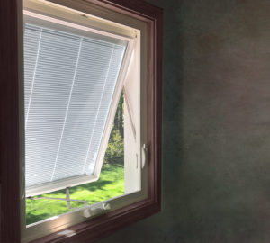 A window with blinds in the open.