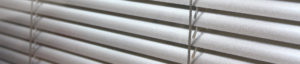 A close up of the blinds on a window
