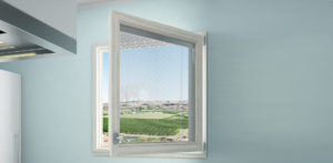 A window with a view of the golf course.